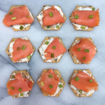 Gluten-free crackers topped with smoked salmon