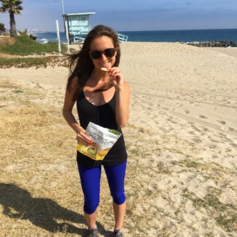 Jackie with Crunchmaster crackers on the beach