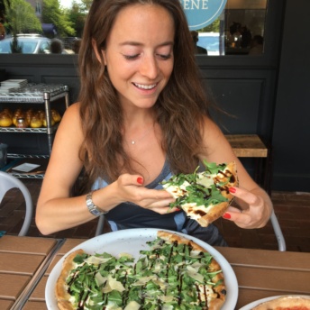 Jackie eating gluten-free pizza at Brick+Wood in CT