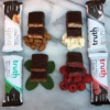 Gluten-free bars covered in dark chocolate by Truth Bar