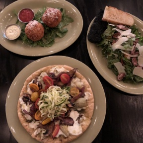 Gluten-free pizza, arancini, and salad from Mangia Nashville