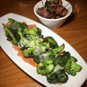 Gluten-free charred broccoli and bacon wrapped dates from Luna Red