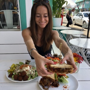 Jackie eating a gluten-free sandwich at Java Kai