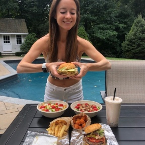 Jackie eating a gluten-free burger from Press Burger