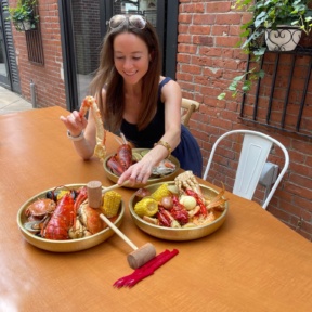 Jackie eating lobster at SONO Boil in CT