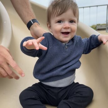 Liam going down the slide at Children's Beach in Nantucket